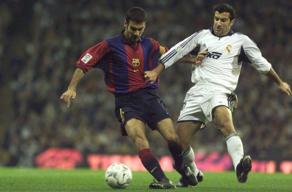 Pep Guardiola and Luis Figo, former Barcelona teammates